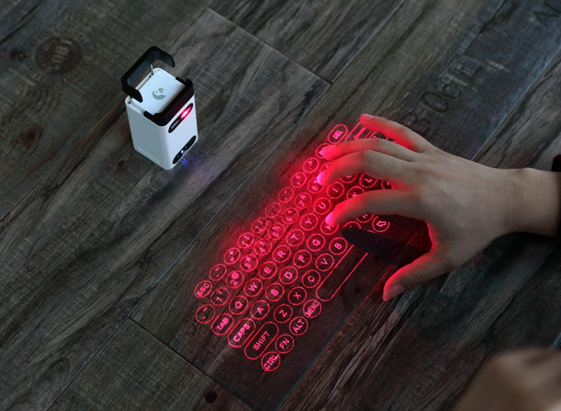 Laserowa klawiatura wyświetlona na biurku