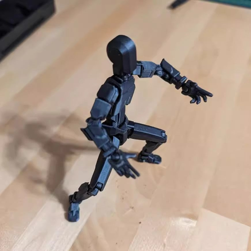 Pomarańczowy ruchomy robot z druku 3D