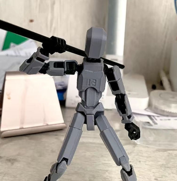 Pomarańczowy ruchomy robot z druku 3D