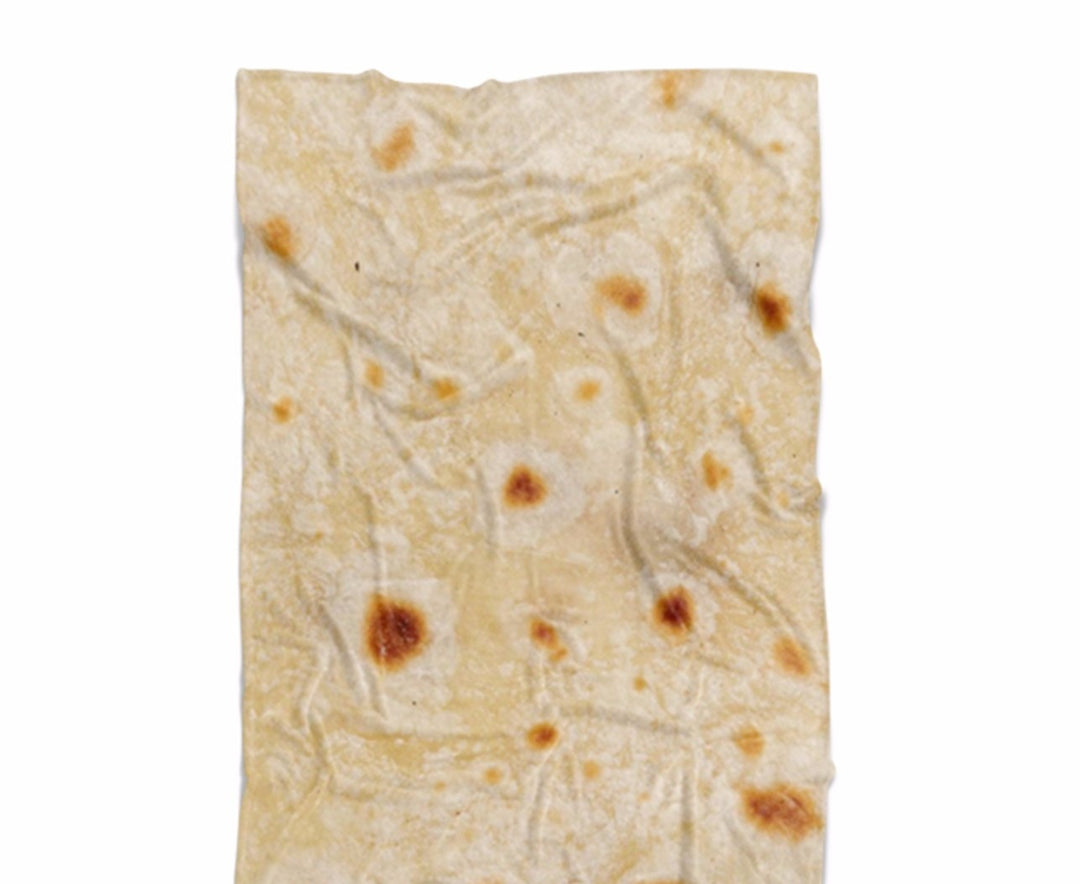 Osoba zawinięta w okrągły koc tortilla